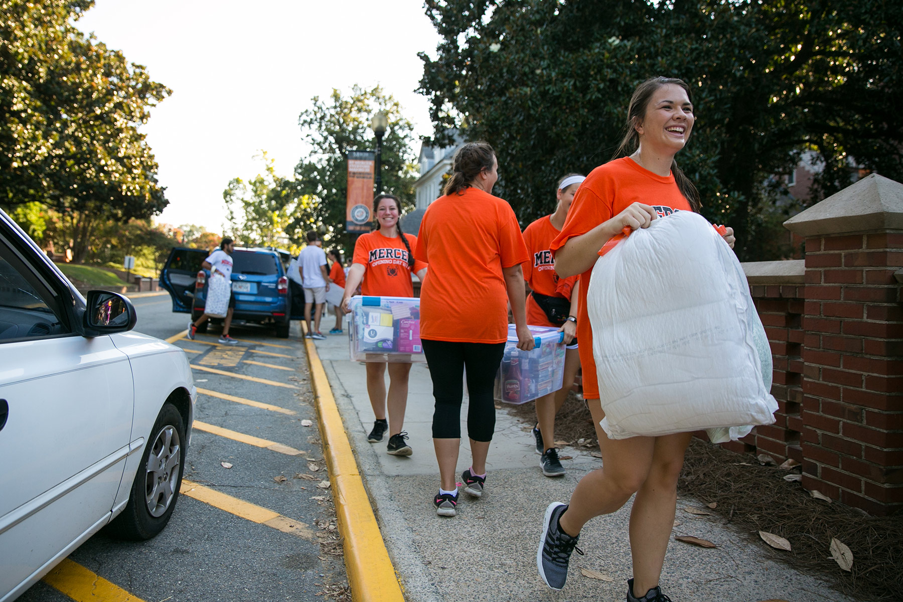 Students helping carry items on move-in day.